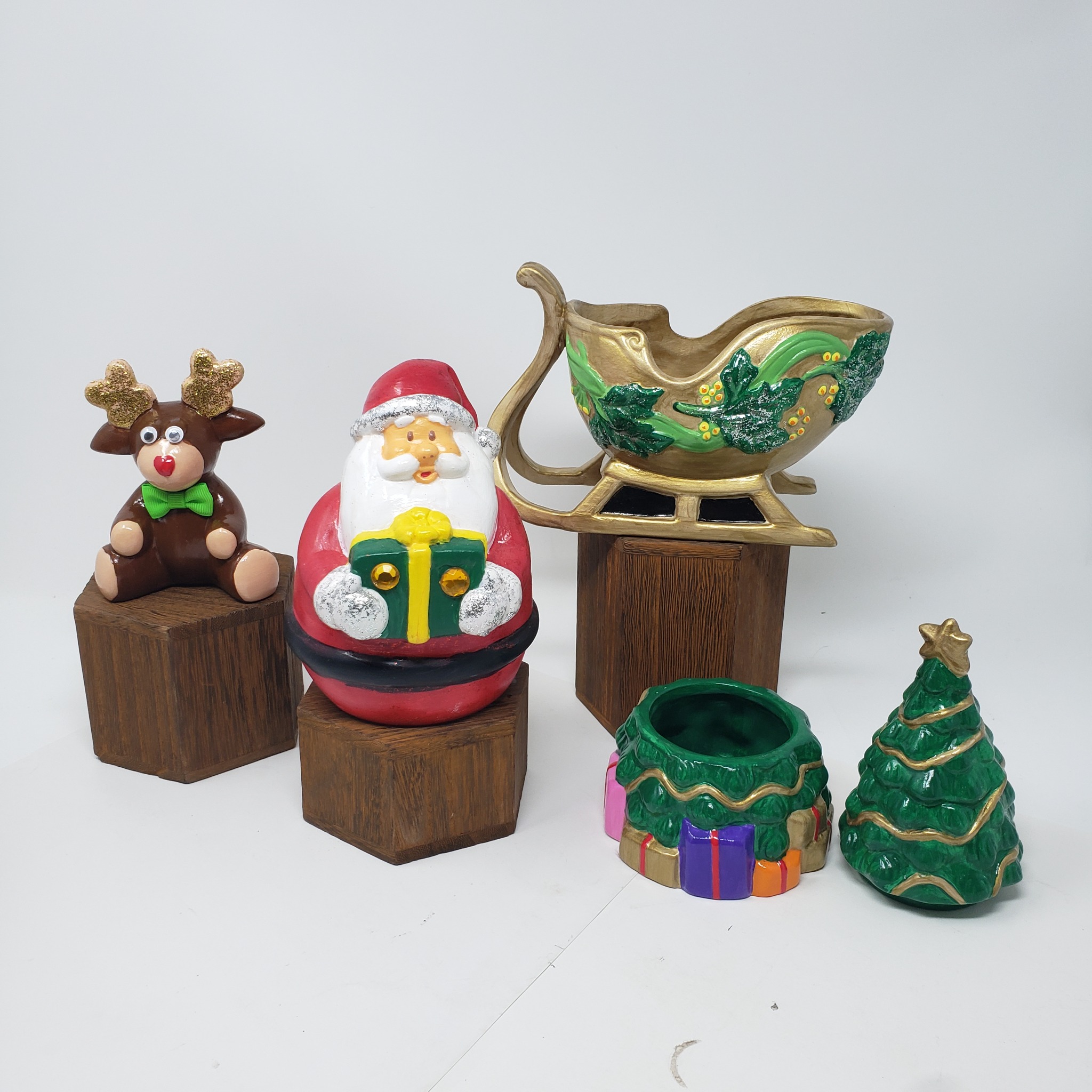 Selection of finished Happy Creations Christmas ceramics including Santa, reindeer, sleigh and Christmas tree